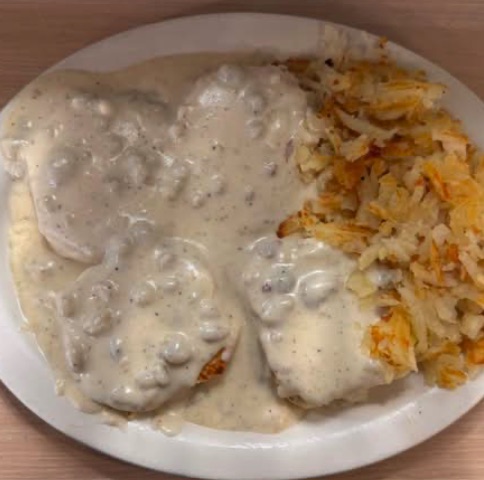 Full order of biscuits smothered in homemade sausage gravy, with hashbrowns