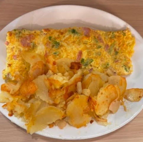 Denver omelette with ham, onions and green peppers, served with American potatoes