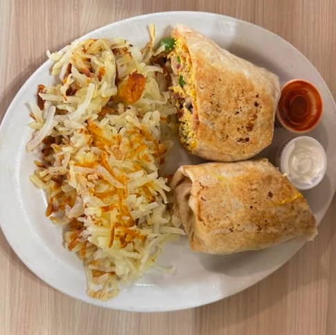 Fiesta breakfast burrito with hashbrowns, salsa and sour cream